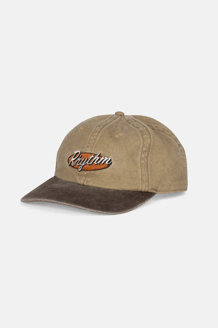 Stay relaxed and stylish with the Hallmark Cap in Sand. This low-profile, 6-panel cap features a deconstructed design with an embroidered logo that adds subtle sophistication. The adjustable snap back closure ensures a perfect fit, while the pigment wash gives it a vintage appeal, enhanced by Rhythm labels and trims