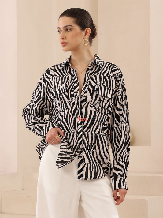 Hunter Shirt - Iris Maxi - a standout shirt designed for modern sophistication and everyday comfort. Crafted from soft, breathable rayon, this shirt showcases an exclusive black and white abstract zebra print that adds an effortlessly chic edge to your wardrobe.