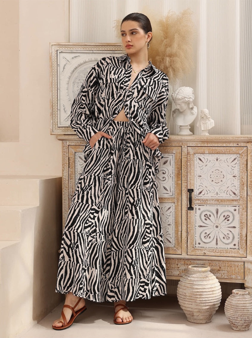 Add a dose of dynamic flair to your wardrobe with the HUNTER Pants, designed in an eye-catching patchwork-style zebra print. These high-waisted, wide-leg pants combine statement fashion with breezy comfort—ideal for sunny days, tropical getaways, or elevated everyday looks.