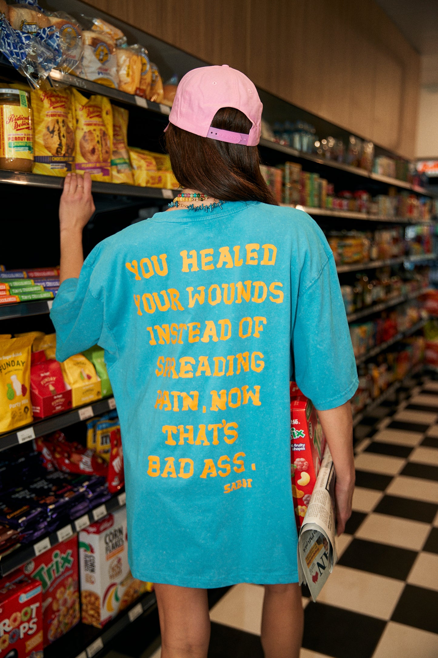 Effortless confidence. Bold statement.
The Very Oversized Self Love Club Tee in Blue is cut from premium soft cotton jersey, washed for a perfectly worn-in feel. Designed in an exaggerated, relaxed silhouette for ultimate comfort and style.
Featuring a collegiate-inspired “SELF LOVE CLUB” front graphic and an empowering back print that reads: “YOU HEALED YOUR WOUNDS INSTEAD OF SPREADING PAIN. NOW THAT’S BAD ASS.” A feel-good essential that combines comfort with unapologetic self-expression.