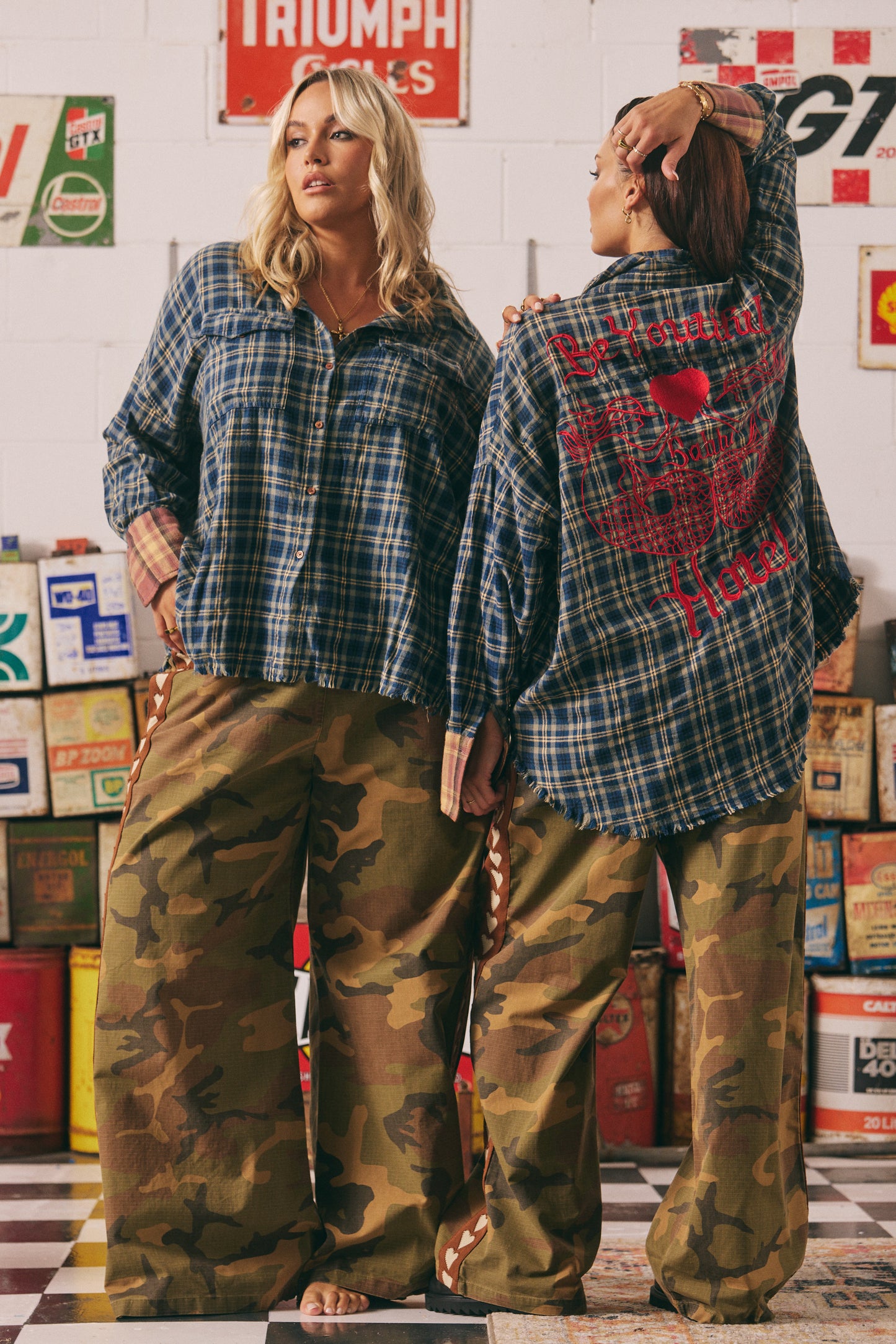Be Youtiful Sabbi Hotel Flannel Shirt
Turn heads and wear your heart on your back with the Be Youtiful Sabbi Hotel Flannel Shirt. This oversized, vintage-inspired button-up blends rugged charm with unapologetic attitude. Featuring bold red embroidery, twin masquerade masks, and the statement "Be Youtiful Babe Hotel" across the back, it's all about self-expression and standout style. Crafted from soft plaid cotton with raw edges for that perfectly worn-in feel — pair it with camo pants or your fave denim and