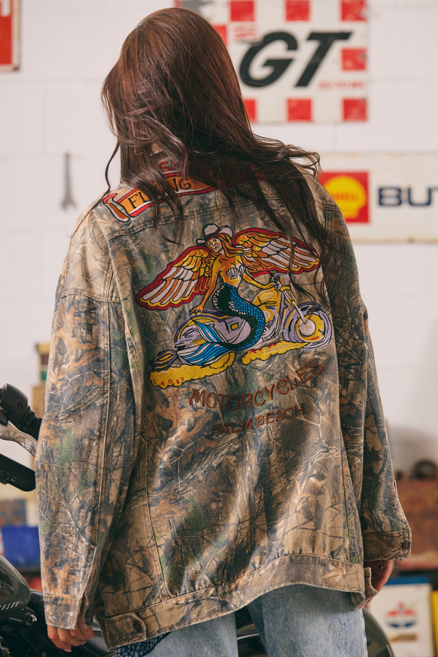 The Mermaid Wandering Jacket
Unapologetically bold and effortlessly cool, The Mermaid Wandering Jacket is where vintage moto vibes meet free-spirited rebellion. Designed in an oversized fit with a worn-in camo wash, this statement piece features intricate embroidery of our signature winged mermaid — a powerful symbol of freedom, femininity, and fearless adventure.