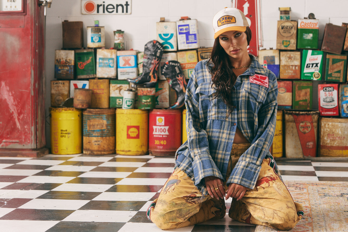 Grit, heart, and horsepower stitched into every thread. The Horse Power Flannel is a rebellious twist on the classic Western plaid — crafted for rule-breakers, wild riders, and soft-hearted renegades.
In a vintage-washed blue and sand check, this oversized shirt features bold yellow “HORSE POWER” embroidery down the sleeve and a custom SABBI “Be Kind” back patch with two galloping pink ponies and a red chenille heart — because strength and softness can ride side by side.