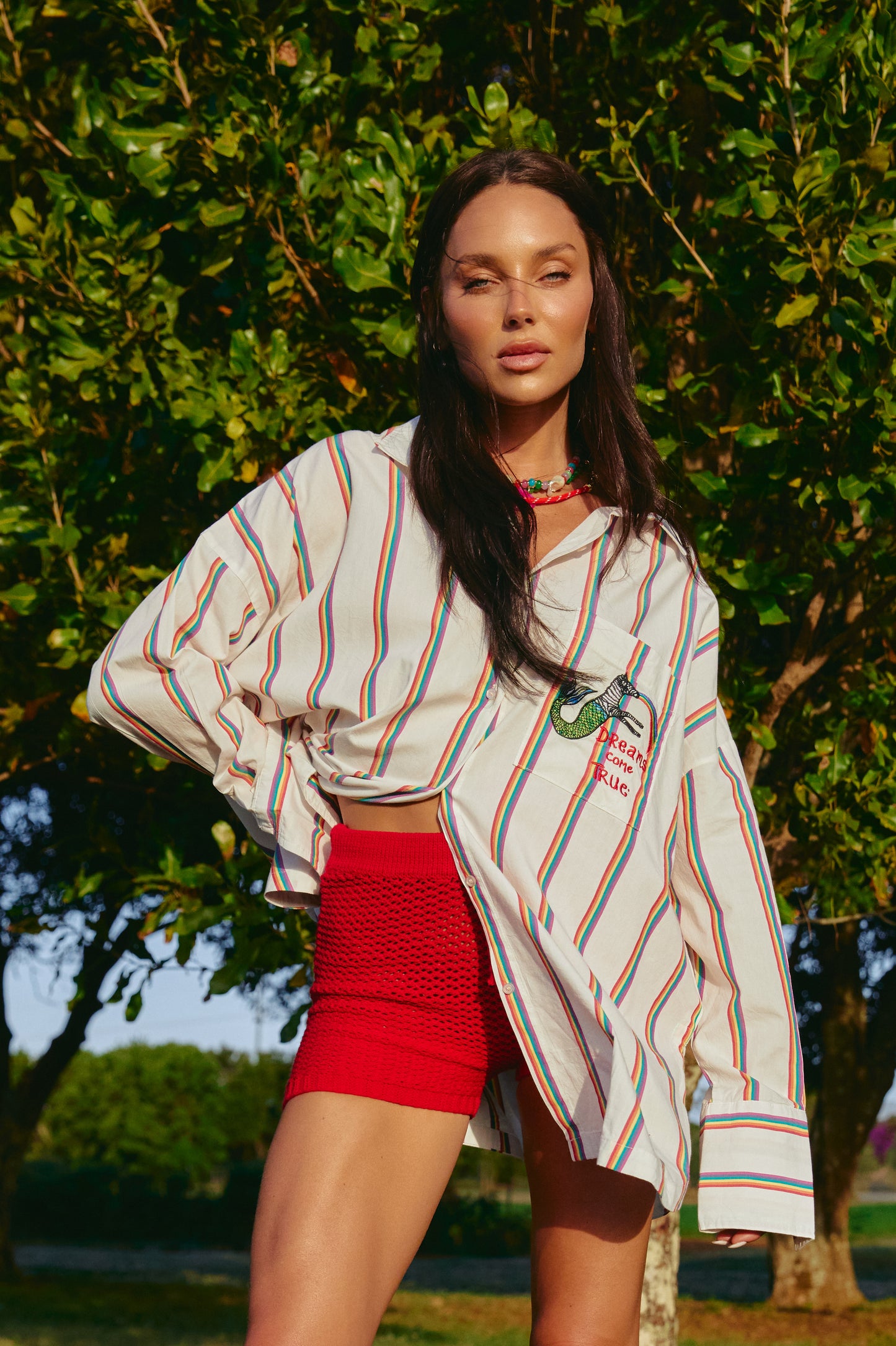 Meet your new happy place in shirt form — the Don Julio Shirt - Rainbow Dreams. This oversized statement piece radiates pure joy with its vibrant rainbow stripes and playful vintage energy.
