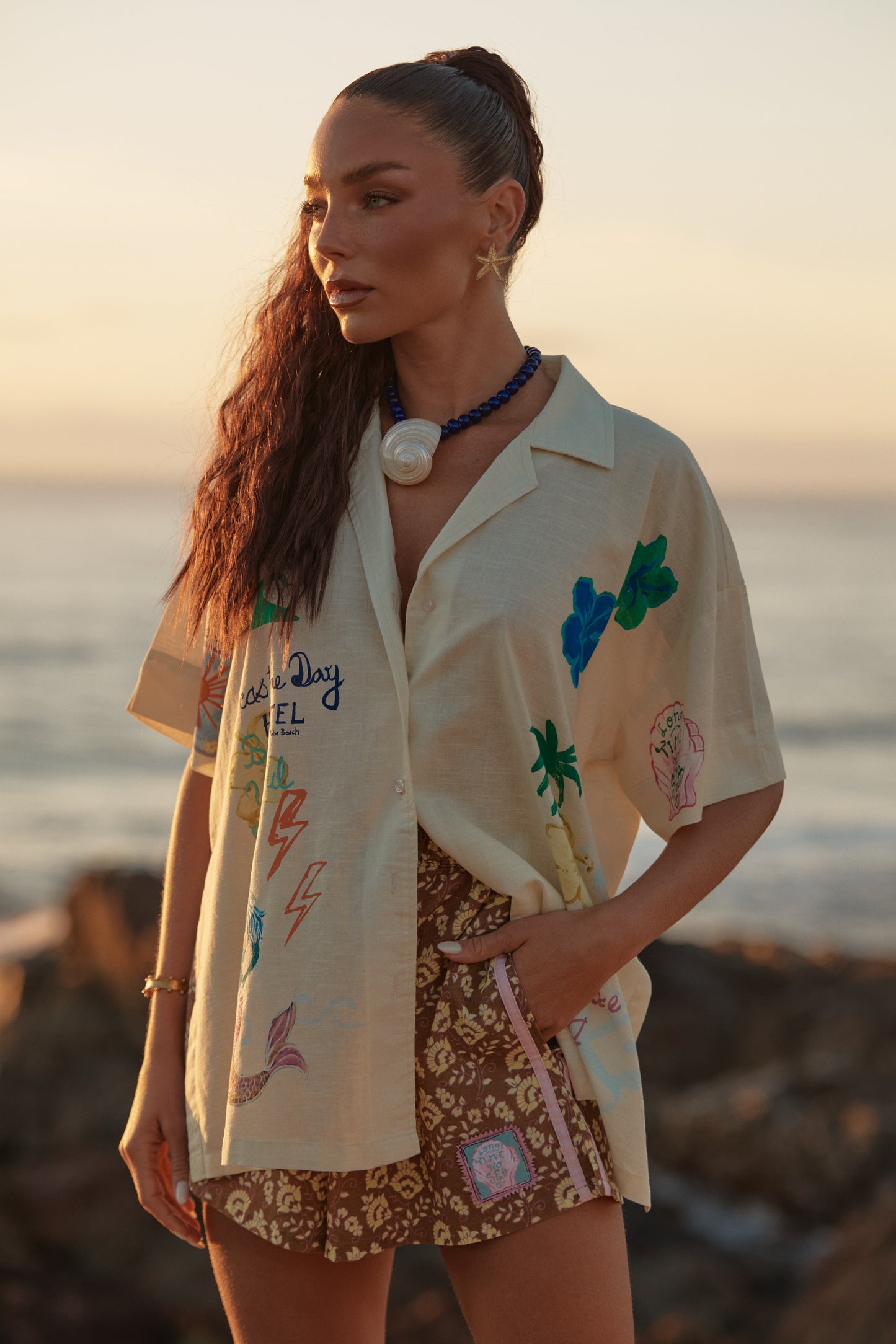 Sabbi - Meet your new coastal statement piece. The Patron Shirt in Cream Seas the Day is relaxed, expressive and effortlessly cool—made for salty air, sun-faded afternoons and spontaneous adventures. Featuring playful hand-drawn graphics inspired by beach days and carefree living, this shirt brings art and attitude together in one easy throw-on layer.