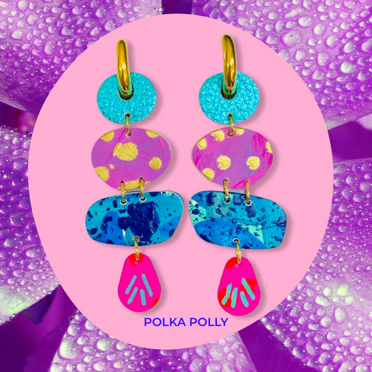 Featuring a complementary mix of metallics and hand painted leather beads in bright pinks, blues, purples and gold – set on golden stainless steel chunky hoops.