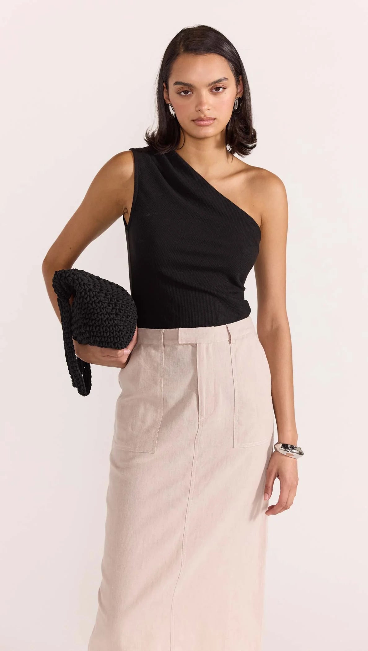 The Dylan One Shoulder Top is your next basic that will help get you through the season in style. Featuring subtle detailing adding that extra dimension to your look to take it from basic to intricate.Style with our Enna Maxi Skirt with heels, layered jewellery and a mini bag to complete your next work to wine look.