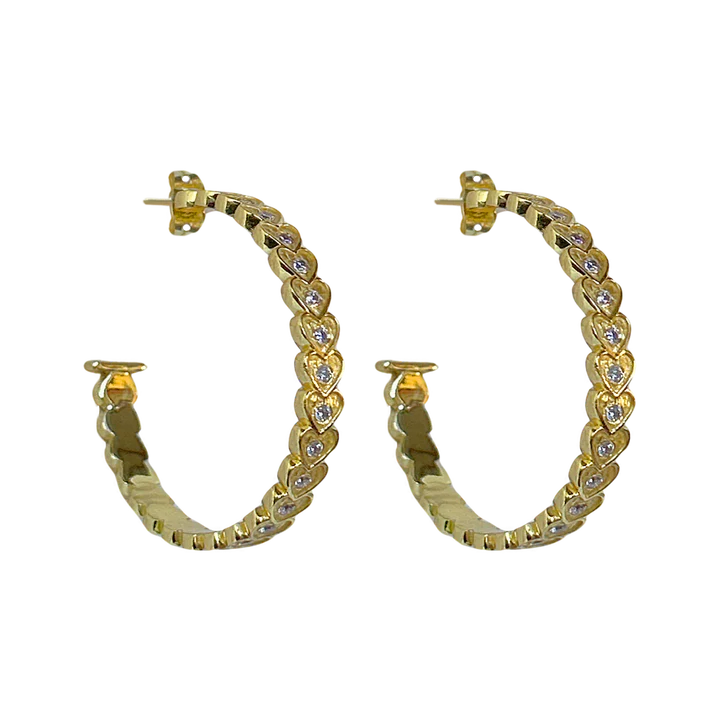 She's fun, she's flirty, she's fabulous... the AMBER Hoops! The iconic and head-turning hoops with a sassy textured heart motif and sparkling CZ. Talk about eye catching and sure to add a playful touch to any look, the Amber hoops will be your go-to accessory. Who doesn’t love a hoop... but make it iconic!