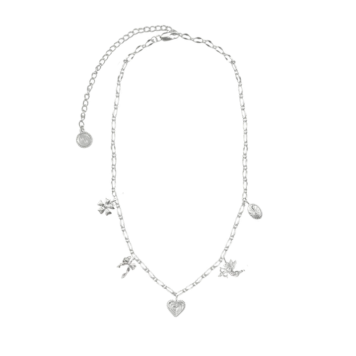 Hello Angel! Introducing the prettiest, most delicate necklace of the collection. The romantic and charming Angel Necklace is bound to steal your heart with its nostalgic, feminine touches featuring a few of our favourite motifs... the flower, bow, heart, cupid and locket, exquisitely strung on an iridescent chain. She is soft yet striking and will have your style float from day to night with ease. So go ahead, indulge in a little romance and charm with this darling necklace.