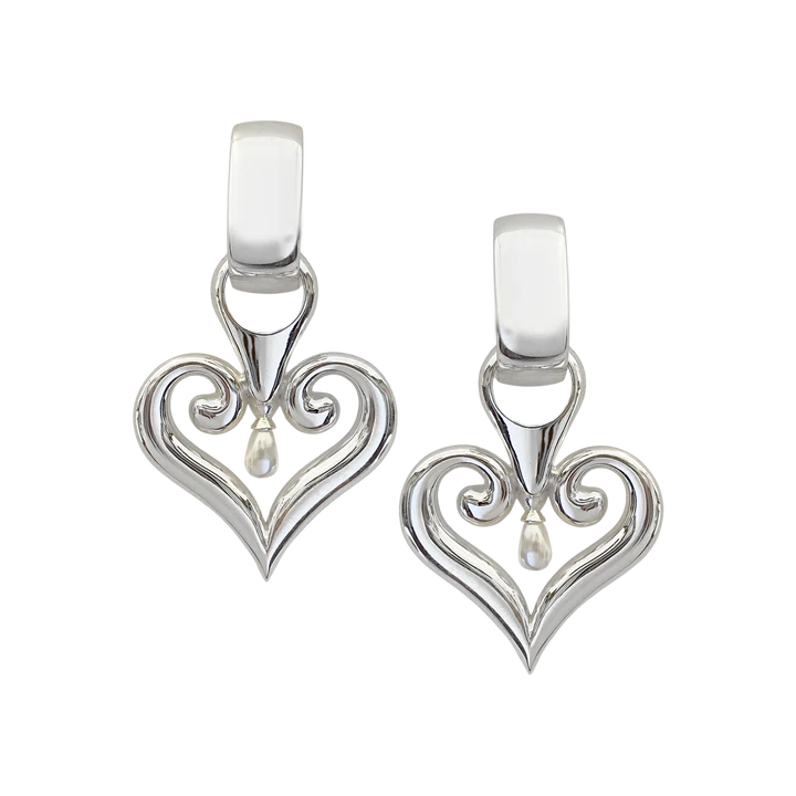 The Bella Earrings are now in silver! Everyone's favourite earrings look sleek, chic & stunning with the timeless Silver hoop and curved heart-shaped pendant accented with a petite pearl. This sophisticated and stylish statement style provides a perfect touch of chic fun to any outfit. A classic design that will pair with almost anything, these earrings will quickly become one of your go-to accessories.