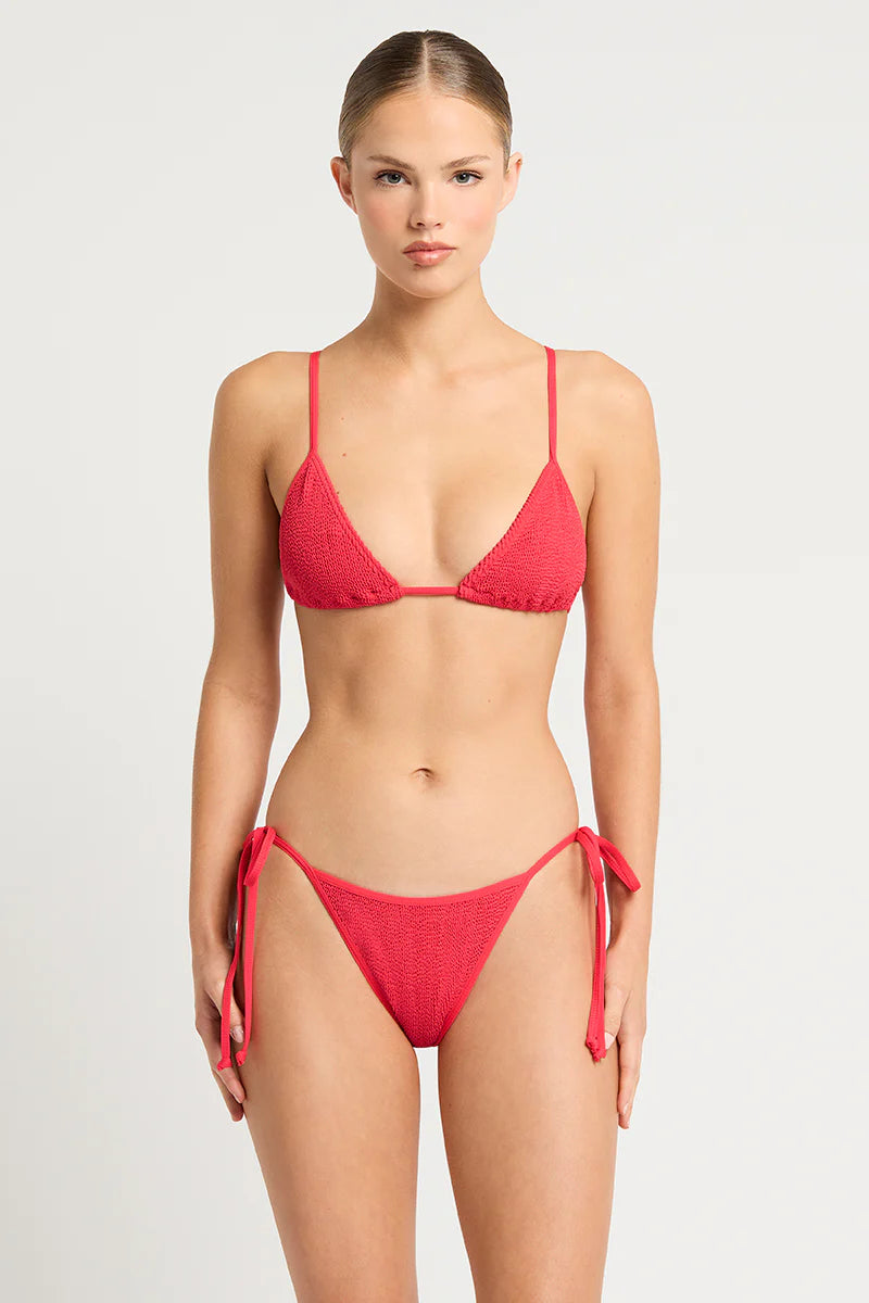 Dive into the shimmering waters with our Anisha Brief, a tie-side beauty offering mid coverage and adjustable ties. Made from The Authentic Crinkle™ fabric in enchanting Bottle Green Lurex, this swimwear style is the perfect blend of comfort and style, exuding a touch of luxury. Designed and handcrafted in Sydney, Australia, it's a must-have addition to your beach wardrobe.