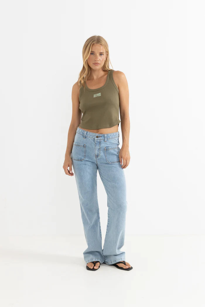 Annette RIb Tank -
A soft ribbed tank with a flattering scoop neckline and a custom chest graphic for a touch of signature branding. Effortlessly lightweight, this piece is perfect for layering or wearing on its own through sun-drenched days.