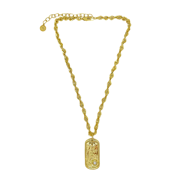 Bold yet refined, the Cypress Necklace is a statement of strength, elegance, and coastal allure. Featuring a thick, twisted gold chain with sculptural detailing, it’s anchored by a modern pendant inspired by the classic dog tag—reimagined with softened edges and elevated design. At its heart sits a luminous freshwater pearl, evoking the calm power of the sea.