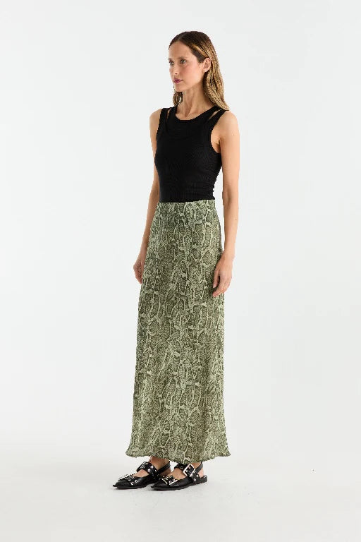 Animal-printed georgette skirt designed with a bias cut to create a graceful and flattering silhouette. Featuring a maxi length and an elasticated waistband, this pull-on style combines ease of wear with a bold, striking aesthetic.