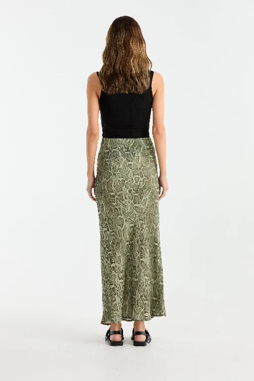 Animal-printed georgette skirt designed with a bias cut to create a graceful and flattering silhouette. Featuring a maxi length and an elasticated waistband, this pull-on style combines ease of wear with a bold, striking aesthetic.