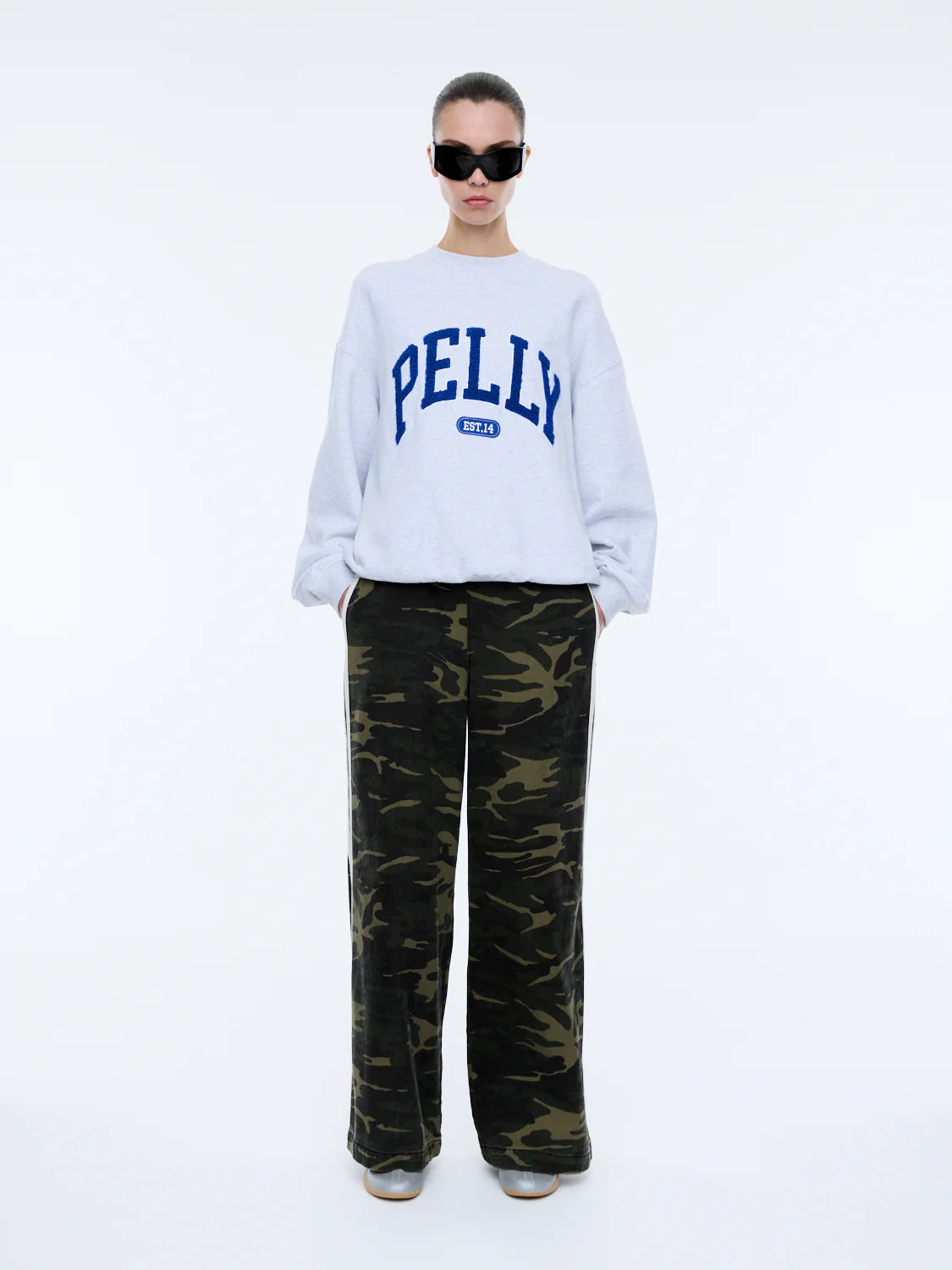 The Anniversary Sweatshirt is crafted from premium cotton terry, offering a soft yet durable texture. Featuring an oversized fit with a crew neckline, ribbed cuffs, and a ribbed neckband, it pairs comfort with elevated style. The exclusive Ena Pelly design is highlighted by a terry applique collegiate print, giving this sweatshirt its distinctive edge.