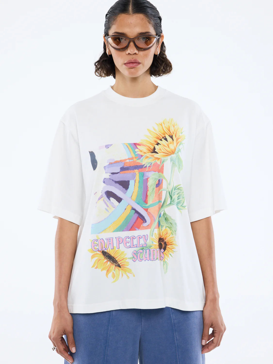 Radiant charm. Effortless style.
The Sunflower Warp Tee is crafted from soft cotton jersey in a relaxed, oversized fit for ultimate comfort. Featuring a vibrant, retro-inspired warp graphic intertwined with bold sunflower illustrations, it channels both nostalgic energy and modern flair. Designed with a classic crew neckline and a lived-in feel, this tee brings a burst of colour and personality to your everyday wardrobe.