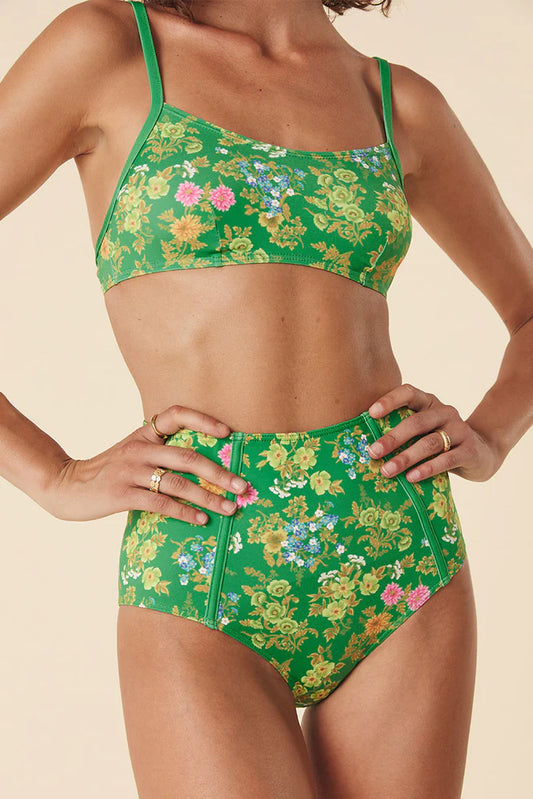 The Flora Scoop Bralette in Citrus Crush is a new take on a familiar Spell style. Endlessly versatile, this supportive and comfortable bralette can be worn as a top with denim or as swim. Featuring the Flora print in striking green with pops of pastel gold and pink florals, this bralette is for the daydreamers with adventurous hearts