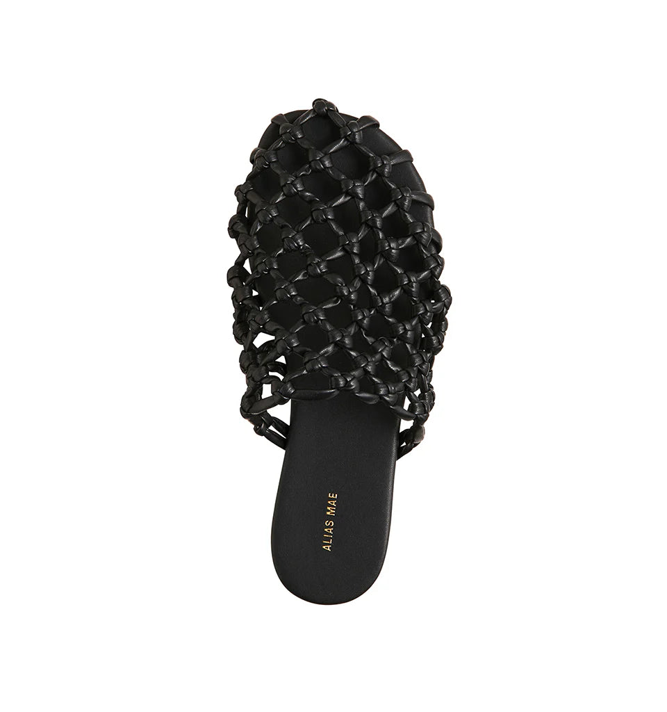 Effortless style meets modern edge with the Hezu slide. Designed with a handwoven lattice upper in sleek black, this slip-on brings a unique texture and elevated touch to everyday wear. The open-weave design keeps things light and breathable, while the minimalist silhouette ensures easy versatility—pair it with relaxed denim, summer dresses, or tailored pants for an instant style upgrade. Finished with a cushioned footbed and flat sole for all-day comfort, the Hezu is your go-to slide for a chic yet underst
