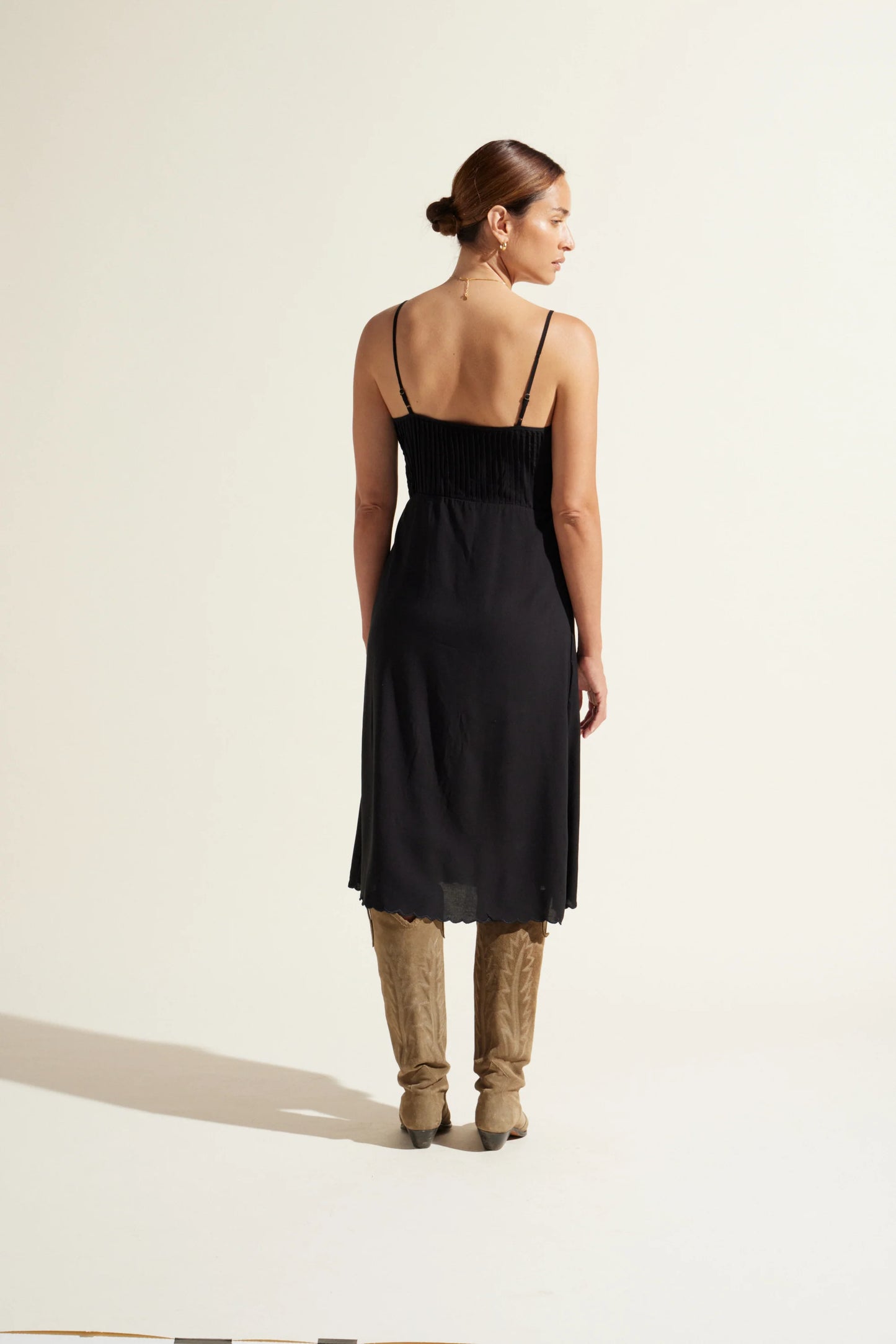 An easy to wear throw on midi dress versatile for day or night.