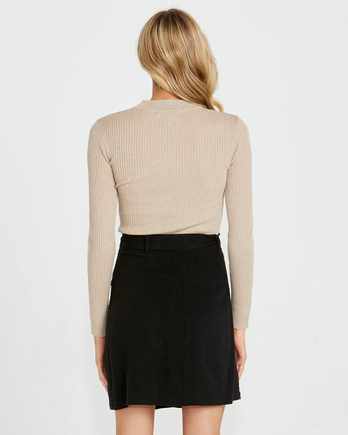 Introducing the Madeline Lurex Knit Top - the epitome of retro disco vibes! With its slim fit and low turtle neck collar, this top takes you back to the glamorous era of disco.