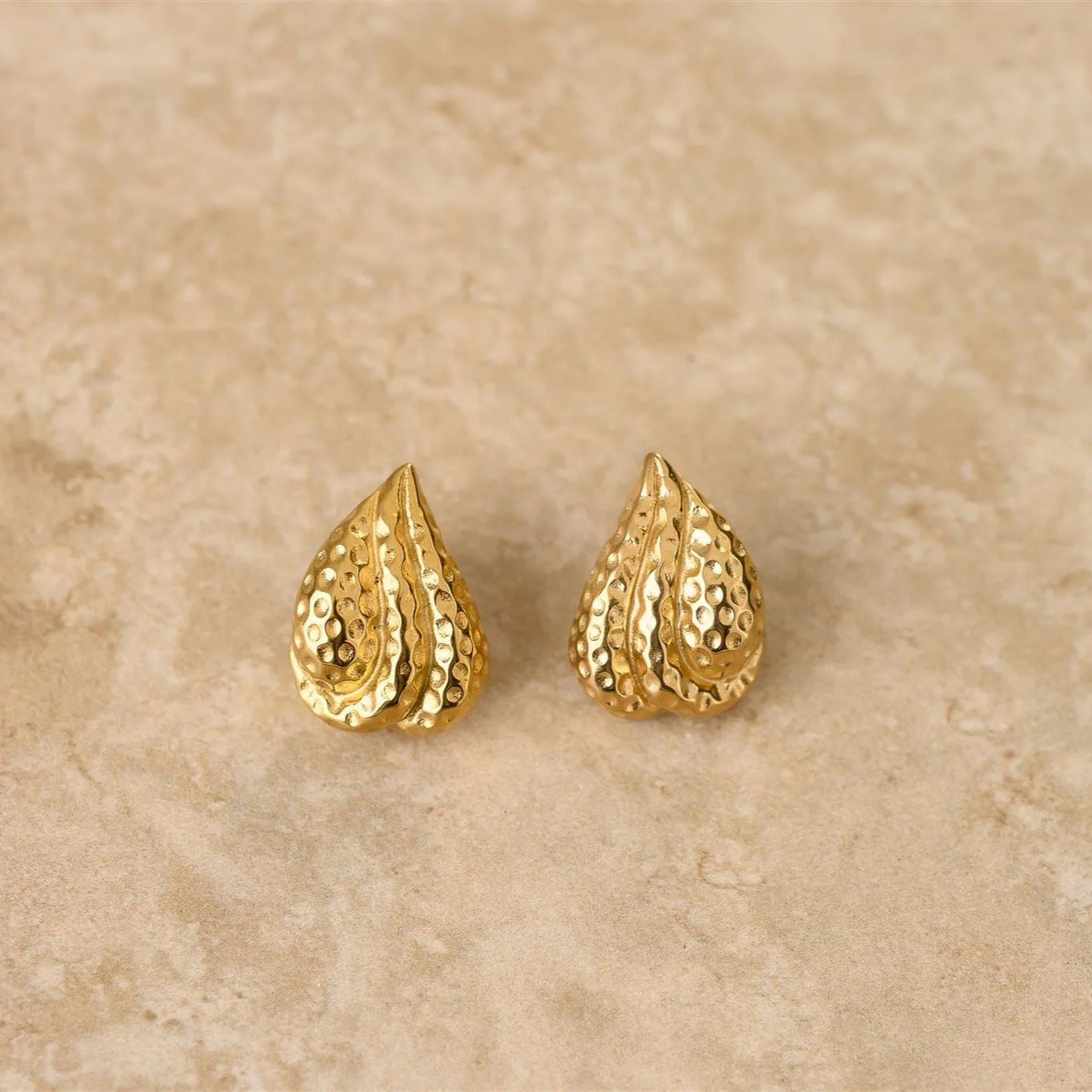 Introducing LUST, our textured tear drop earrings. With their unique design and elegant texture, these earrings are sure to add a touch of luxury and exclusivity to any outfit.
18Kt Gold Plated Sterling Silver
Crushed Gold Textured Style
Lead,Nickel & Tarnish Free
Hypoallergenic
Measures 2.4cm in length & 2.3cm in width
Weight 19g