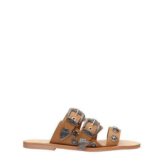 The bestselling Eastwood slide with it’s signature heavy buckles and stud hardware details. Three prominent straps in a soft leather wrap the foot and sit atop a flattering almond shaped sole.