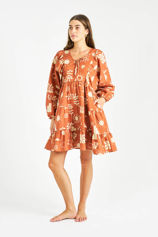 The Carney Dress by Primrose the Label features puff long sleeves with elastic cuff in an exclusive print. 