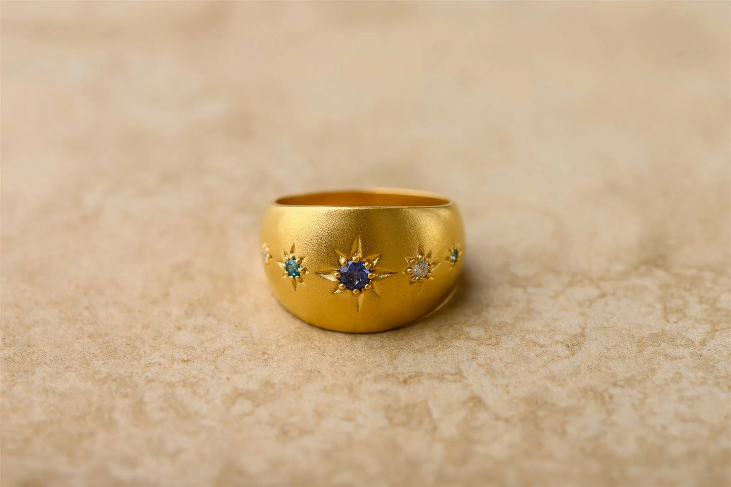 Introducing Celeste, the star of the show! This high end chunky ring features star shaped sapphire stones, making it the perfect accessory for adding a touch of celestial glamour to any outfit. Shine bright like the night sky with Celeste.
925 Gold Plated Sterling Silver
Sapphire Stones
Lead,Nickel & Tarnish Free
Hypoallergenic
Waterproof
Dimensions
Band Width | 13.3mm
Stone Size | 1.5mm/2mm/3mm