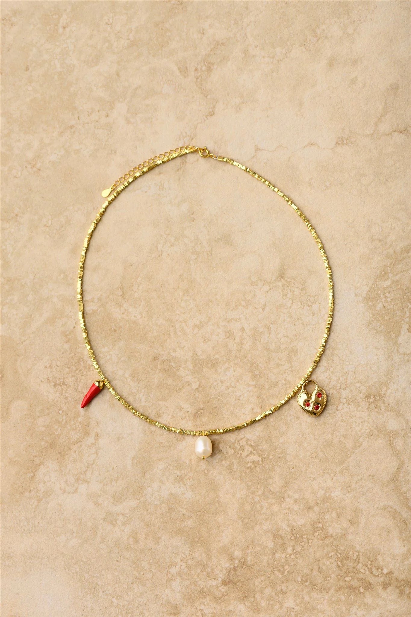 Add a fiery touch to your style with our Chilli Charm Necklace! This eye-catching piece features three vibrant red chilli charms dangling from a stunning crushed gold chain. Perfect for spicing up any outfit, this playful accessory brings just the right amount of heat to your jewellery collection. Makes a sizzling statement whether dressed up or down!
925 Gold Plated Sterling Silver
Lead,Nickel & Tarnish Free
Hypoallergenic
Waterproof