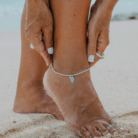 Embark on a dreamy island adventure with our Island Dreaming Anklet. Handcrafted with love, this anklet features Hilltribe Silver beads and charms that exude bohemian charm and coastal elegance. The Poly Wax cotton cord adds a touch of natural texture, while the Sterling Silver clasp and adjustable link ensure a secure and comfortable fit. Let the Island Dreaming Anklet be a reminder of carefree days and the beauty of island living.