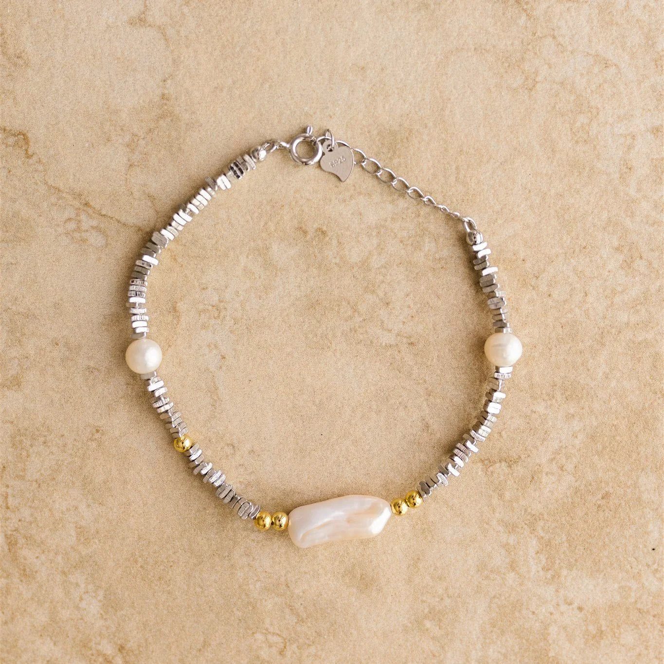 Introducing LUANA, the stunning embellished bracelet. This piece adds a touch of elegance and beauty, making it the perfect piece for your your special day!
S925 Crushed Sterling Silver
Baroque Pearl/Freshwater Pearl/Semi Precious Stones
Lead, Nickel & Tarnish Free
Hypoallergenic
Measures 20cm in length
