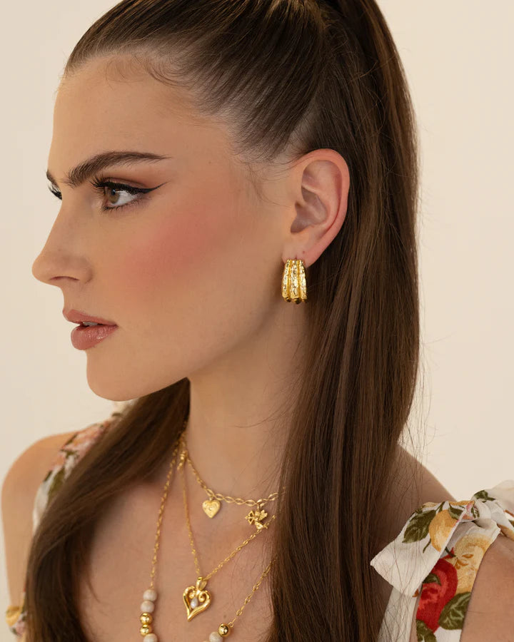 Okay let’s talk about the Jones Earring! Oh so fabulous and effortlessly chic. A silver chunky huggie style that hugs the ear with finesse and features our signature hammered texturing. The Jones is a classic shape and perfectly flows from day to night, paired with your favourite tee and denim, a suit set or summer florals, understated yet bold, she is versatile to say the least. Inspired by the power woman who can do it all. The Jones Earrings will have you feeling exactly that way… Get ready for the compl