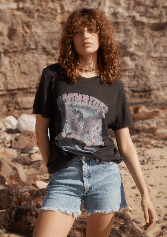 The Moonrider Classic Tee in black by Auguste the label is crafted from a soft, sustainable cotton blend. It features a crew neckline and a bold, graphic print on the front, designed by our talented team.
- Crew neckline
- Fits true to size; go with your usual
- 55% Hemp; 45% Organic Cotton
- Lightweight jersey with a soft hand feel
- Cold machine wash