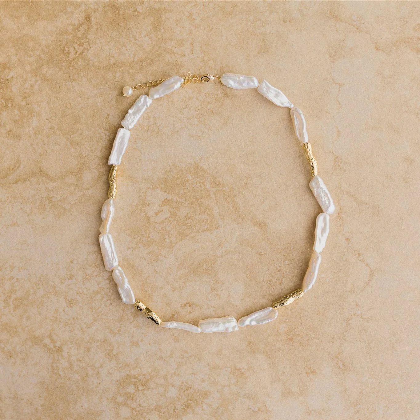 Add a touch of luxury to your look with the MALAKAI Necklace. This high end baroque pearl necklace is pure elegance, making it a must-have accessory.
18Kt Gold Vermeil
Crushed Gold/Pure Baroque Pearl
Lead,Nickel & Tarnish Free
Hypoallergenic
Measures 40cm + 6cm in length
Weighs 24.9g