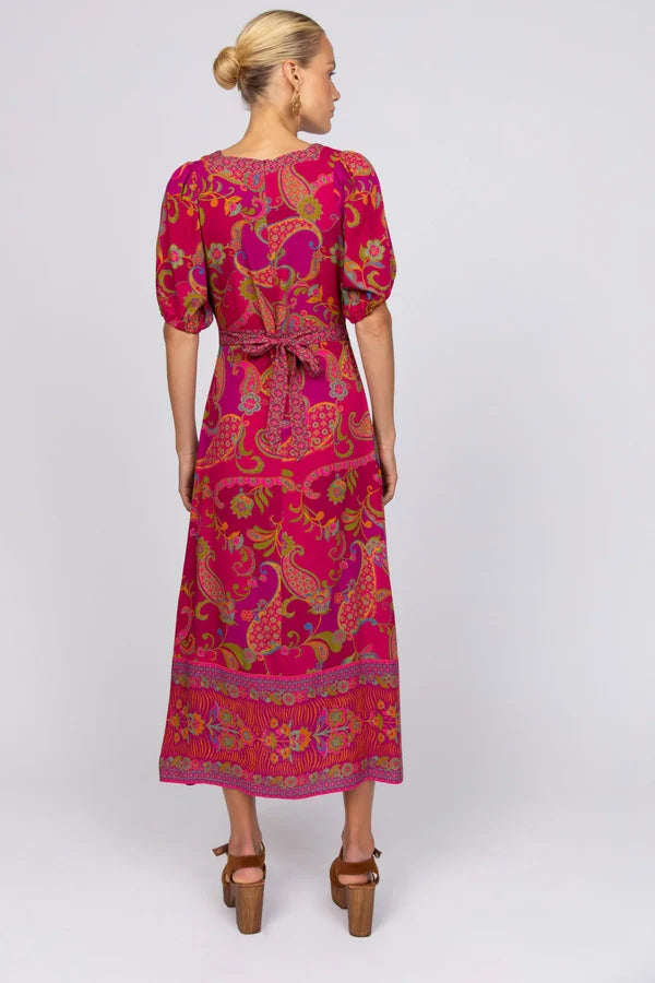 Our Nicola midi dress is all about easy charm and everyday wearability. With soft puff sleeves, a classic square neckline, and apron-style ties that cinch at the back, it blends a timeless silhouette with a hint of playful detail. A flattering fit that feels as good as it looks—perfect for all body shapes and sizes.