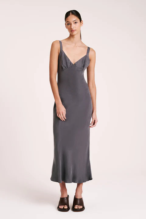 The Roni Cupro Slip Dress is made from our signature cupro fabrication with a smooth suede hand feel. Cut on the bias, this silhouette drapes over the body softly and finishes ankle length. Features include a v neckline with a gathered under bust seam, thick adjustable shoulder straps.