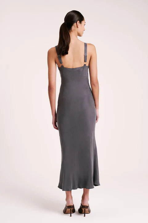 The Roni Cupro Slip Dress is made from our signature cupro fabrication with a smooth suede hand feel. Cut on the bias, this silhouette drapes over the body softly and finishes ankle length. Features include a v neckline with a gathered under bust seam, thick adjustable shoulder straps.