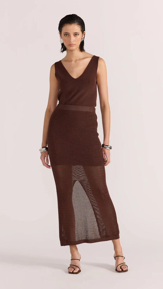 The Portico Crochet Knit Skirt by Staple the Label features an open knit fabrication, and a warm-toned chocolate wash. Style with the matching Portico Crochet Polo Top, or the new-in Portico V-Neck Tunic Knit to complete the look.