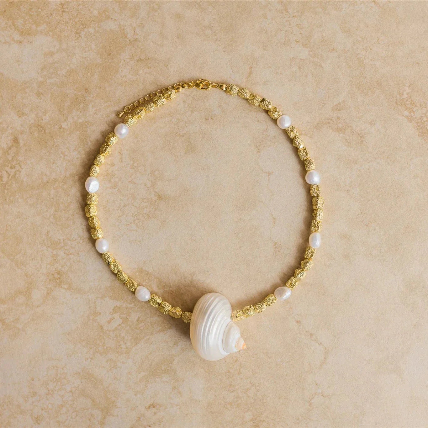 Embrace the ocean's beauty with our PARADISO Necklace! Crafted from luxurious gold vermeil, this stunning necklace features a conch shell pendant that will transport you to the seaside.
24Kt Crushed Gold Vermeil
Freshwater Pearl/Conch Shell
Lead,Nickel & Tarnish Free
Hypoallergenic