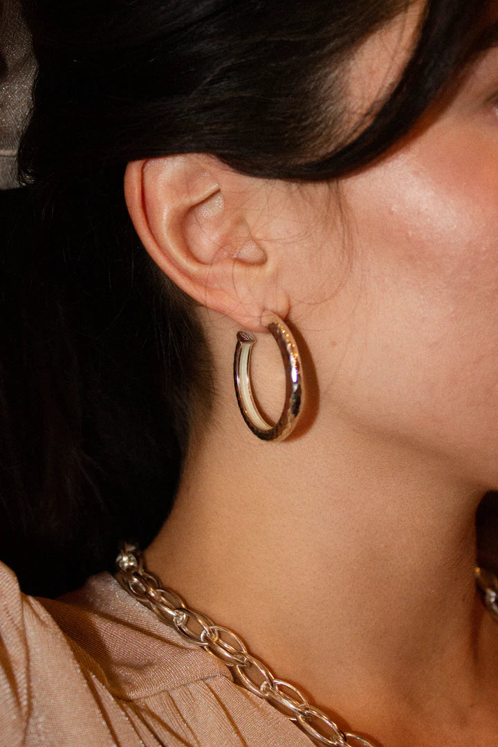 If you're looking for the perfect hoop to up your everyday accessory game, or if you just need more to complement your current collection, let's have an ear party! The hoops of your dreams have arrived. Lola loves nothing more than to let you shine honey. These are your classic round hoops with a twist, and let us tell you, these will not disappoint! If you can think of one outfit that these hoops won't go with, then be our guest, we are yet to find one! You really can't go wrong with these perfec