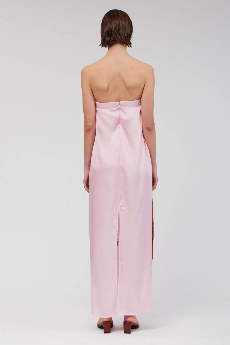 Step into relaxed sophistication with the Emilia Bustier Maxi Dress. Featuring a bold, enlarged red floral print on pink, this silky piece is perfect for a daytime event or a balmy summer soirée. Make a statement in this stunning max.