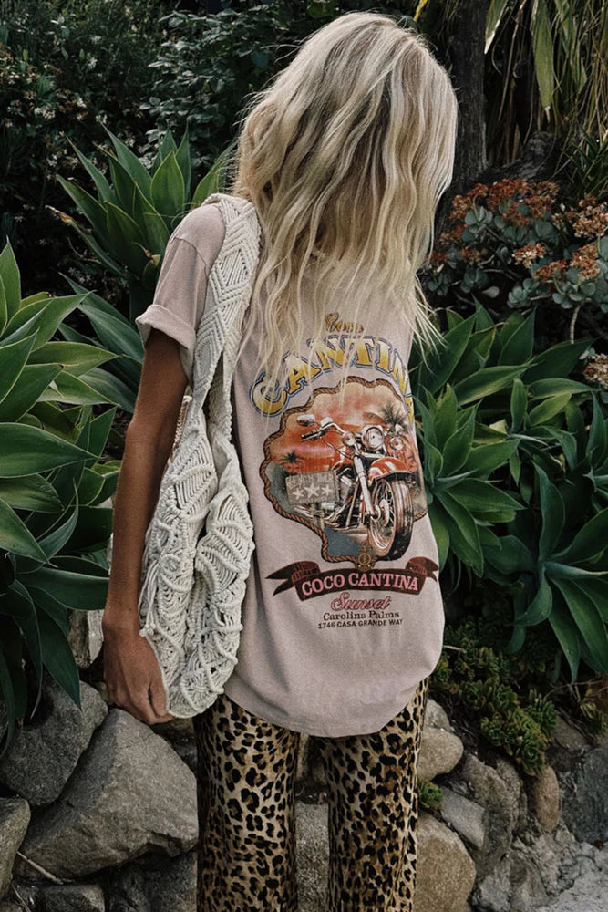 COCO CANTINA BIKER TEE – TAUPE
Channel effortless cool with the Coco Cantina Biker Tee in a perfectly sun-faded taupe. Inspired by desert highways and vintage biker energy, this tee features a bold motorcycle graphic and “Coco Cantina” emblem that feels straight out of a retro postcard. Designed in an oversized silhouette, it's crafted from breathable cotton for that lived-in, throw-on-and-go feel.