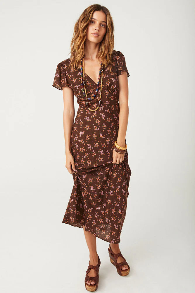 Our Melody Bias Maxi Dress in Antique Walnut is crafted for the heartbreakers. An exquisite showstopper, our dress is cut to flatter the waist and glide over the hips accentuating your silhouette. Soft pink ditsy florals ramble across a backdrop of deep chocolate brown, flutter sleeves float sweetly at the shoulder and the V neckline and low V back adds a sensual touch. Pair with mules and fine jewels for date night or with combat boots and a slouch bag for something a little more rock and roll.