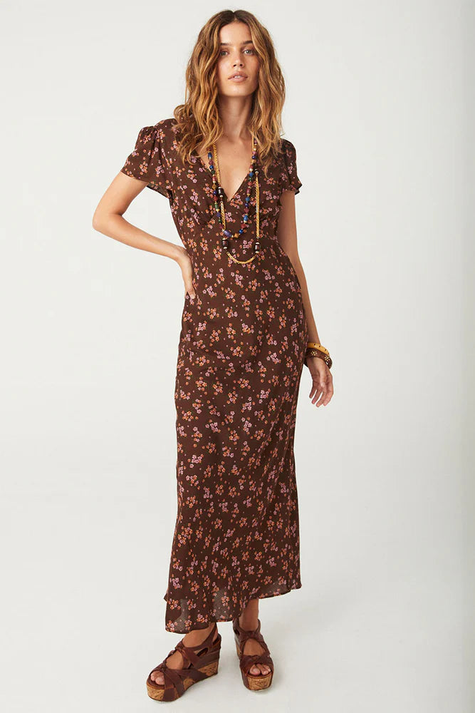 Our Melody Bias Maxi Dress in Antique Walnut is crafted for the heartbreakers. An exquisite showstopper, our dress is cut to flatter the waist and glide over the hips accentuating your silhouette. Soft pink ditsy florals ramble across a backdrop of deep chocolate brown, flutter sleeves float sweetly at the shoulder and the V neckline and low V back adds a sensual touch. Pair with mules and fine jewels for date night or with combat boots and a slouch bag for something a little more rock and roll.