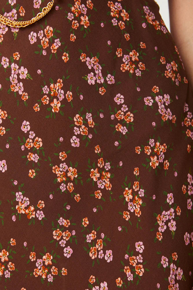 Our Melody Bias Maxi Dress in Antique Walnut is crafted for the heartbreakers. An exquisite showstopper, our dress is cut to flatter the waist and glide over the hips accentuating your silhouette. Soft pink ditsy florals ramble across a backdrop of deep chocolate brown, flutter sleeves float sweetly at the shoulder and the V neckline and low V back adds a sensual touch. Pair with mules and fine jewels for date night or with combat boots and a slouch bag for something a little more rock and roll.