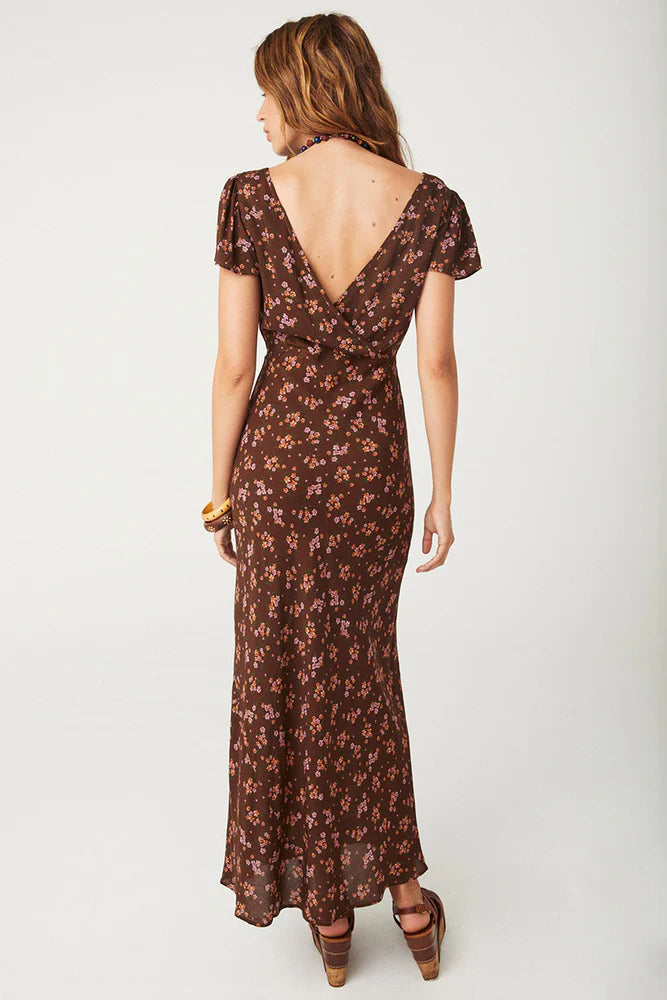 Our Melody Bias Maxi Dress in Antique Walnut is crafted for the heartbreakers. An exquisite showstopper, our dress is cut to flatter the waist and glide over the hips accentuating your silhouette. Soft pink ditsy florals ramble across a backdrop of deep chocolate brown, flutter sleeves float sweetly at the shoulder and the V neckline and low V back adds a sensual touch. Pair with mules and fine jewels for date night or with combat boots and a slouch bag for something a little more rock and roll.
