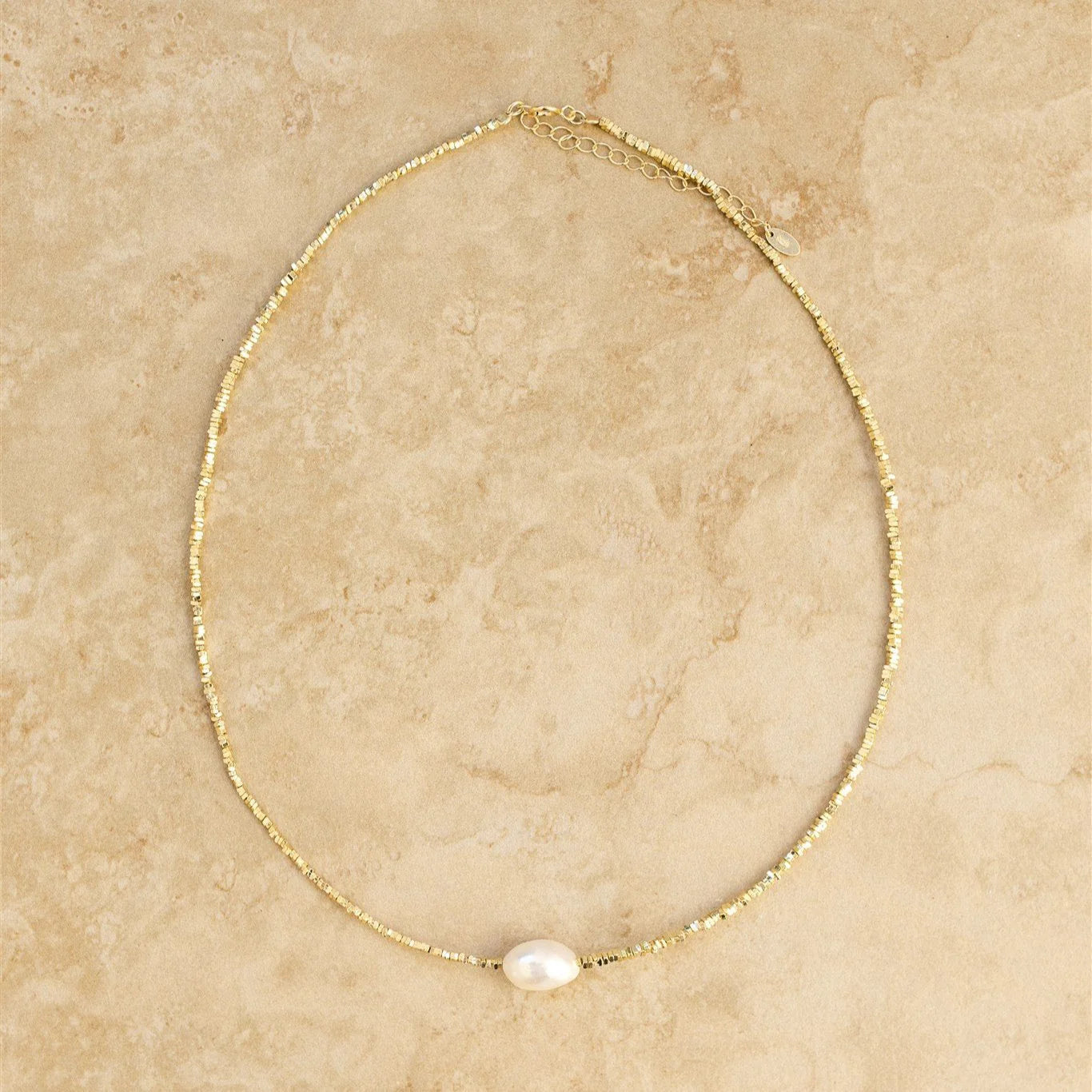 Get ready to crush your style game with TAHITI. Featuring a unique crushed gold pearl design, this necklace will add a touch of whimsy and fun to any outfit. Pair this perfectly with the TAHITI bracelet.
S925 Gold Plated Sterling Silver
Crushed Gold/Freshwater Pearl
Lead, Nickel & Tarnish Free
Hypoallergenic
39cm + 5cm adjustable in length