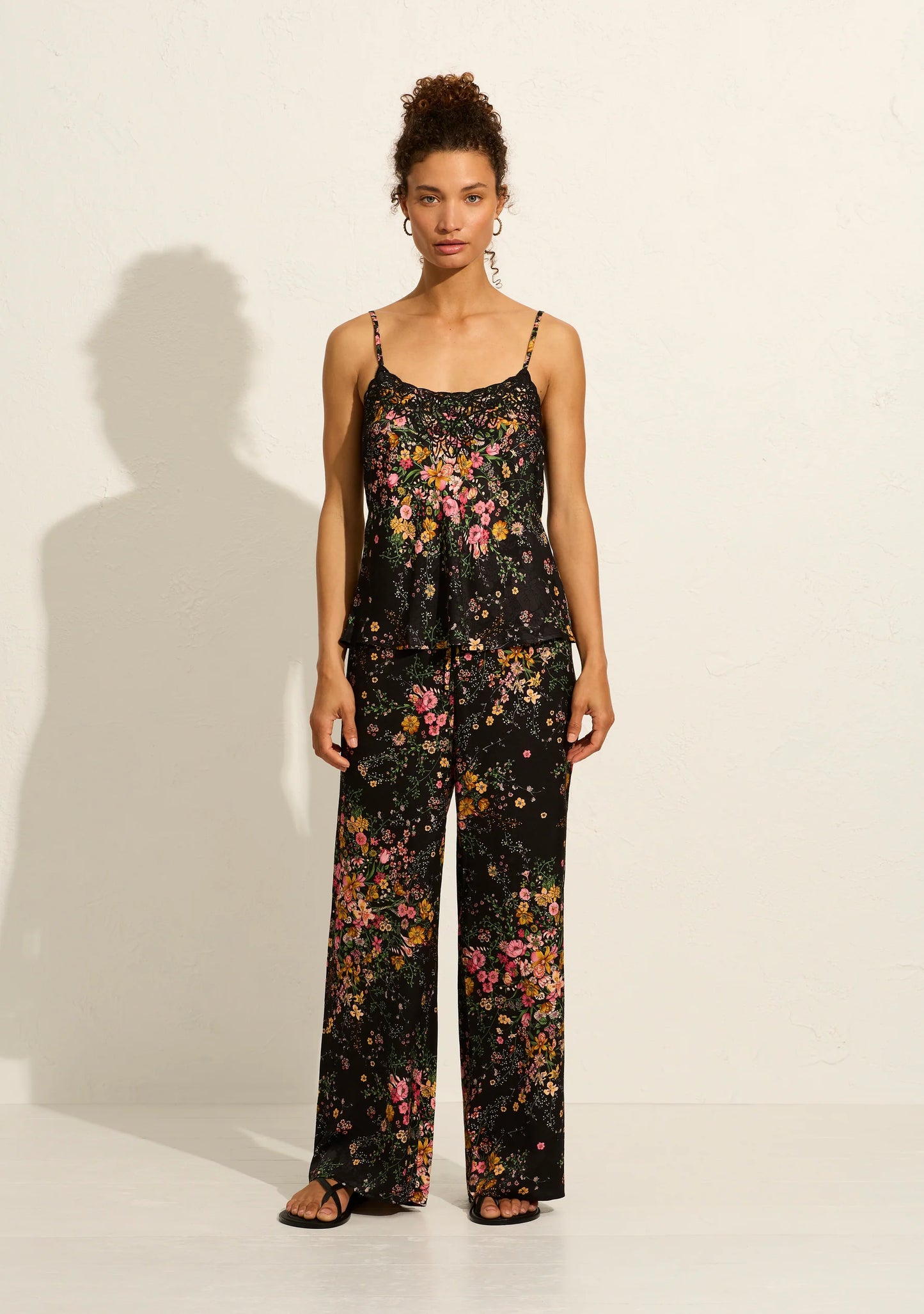 The Martha Pants in our exquisite black-based Whisper Floral are high-waisted and incredibly comfortable, featuring a functional drawcord waist. Crafted from slinky floral-textured jacquard, they pair perfectly with the Theodore Cami, creating the "world's best set."