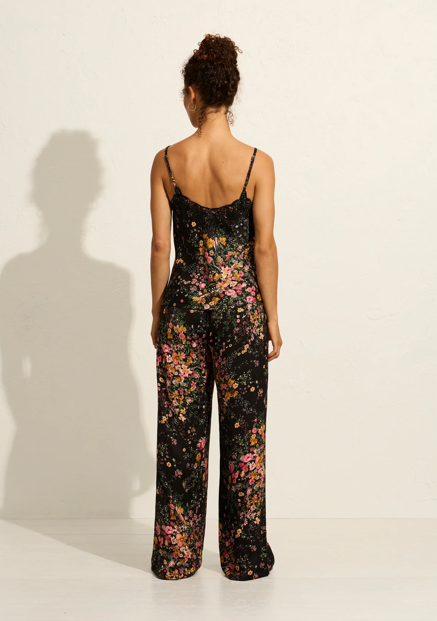 The Martha Pants in our exquisite black-based Whisper Floral are high-waisted and incredibly comfortable, featuring a functional drawcord waist. Crafted from slinky floral-textured jacquard, they pair perfectly with the Theodore Cami, creating the "world's best set."